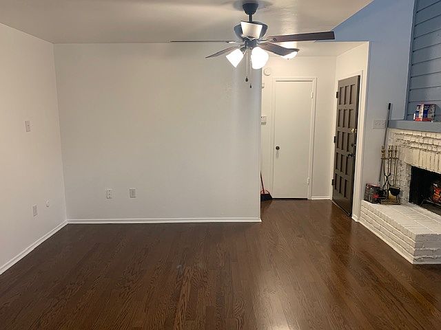 Another view of living area with fireplace