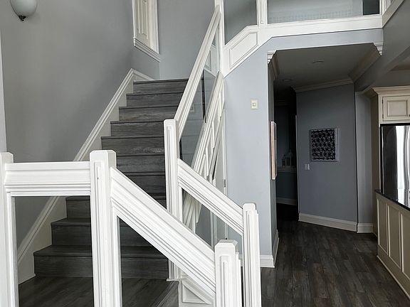 Glass staircase leading to Loft area.