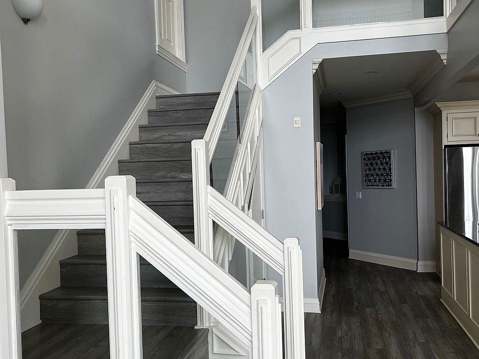 Glass staircase leading to Loft area.