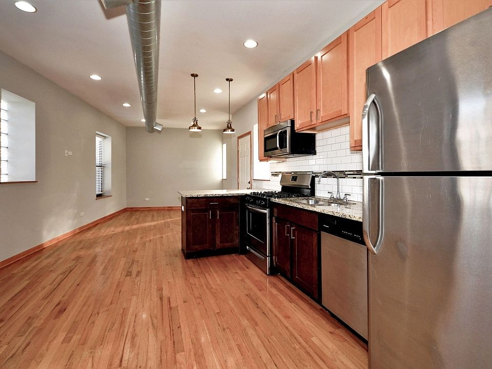 Loads of cabinetry, exposed ductwork, space for kitchen table if desired!