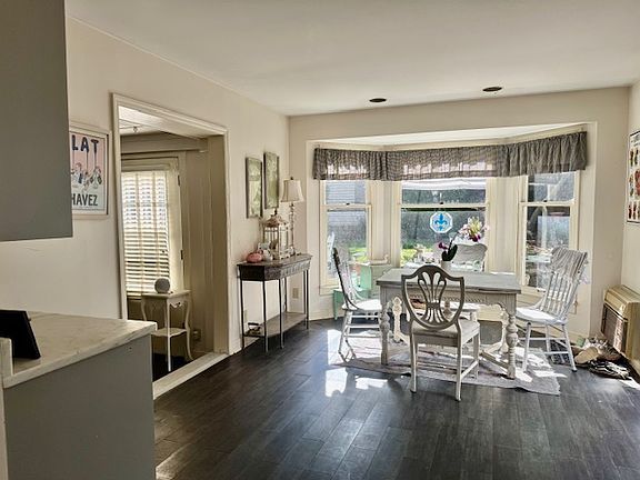 Breakfast area. door to the left goes into an office area, to the right goes outside to the back yard.