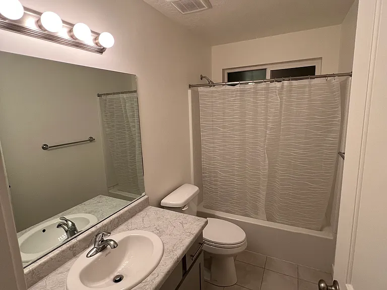 Bathroom located on the top floor between two bedrooms.