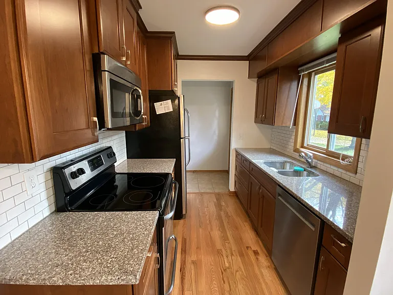 Kitchen with dishwasher, microwave and garbage disposal