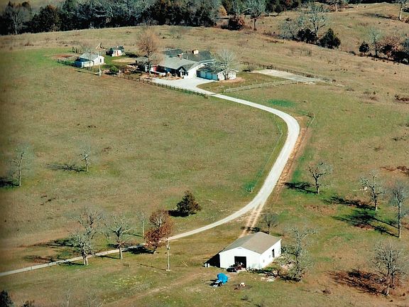 Aerial view of home and bldg