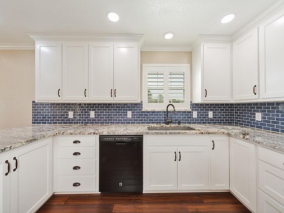 Kitchen with Oven Range, Microwave, Refrigerator/Freezer & Dishwasher