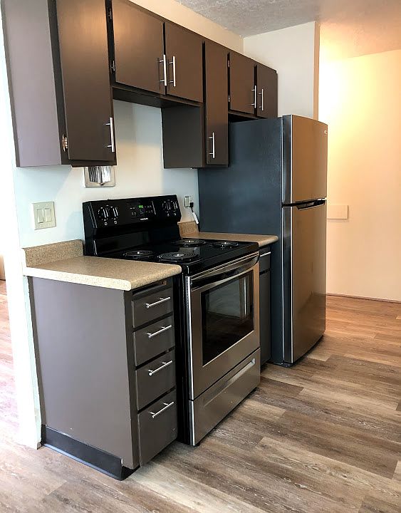 New stainless steel refrigerator and stove with self cleaning oven