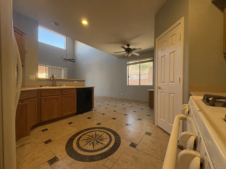 Tiled kitchen to your right as you enter from the foyer