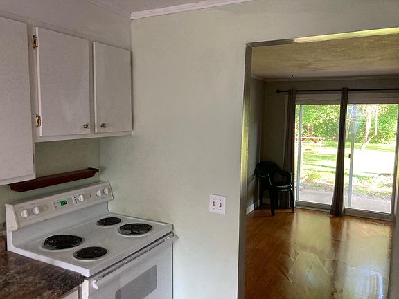 Kitchen view to living space and back patio