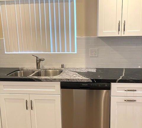 Custom kitchen with granite countertops and custom made cabinets with slow close drawers