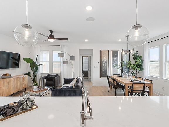 Kitchen with sleek pendant lighting