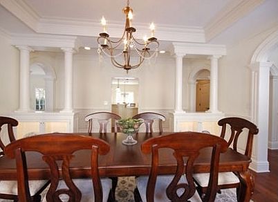 dining room, with coffered ceilings and lighted display cabinets