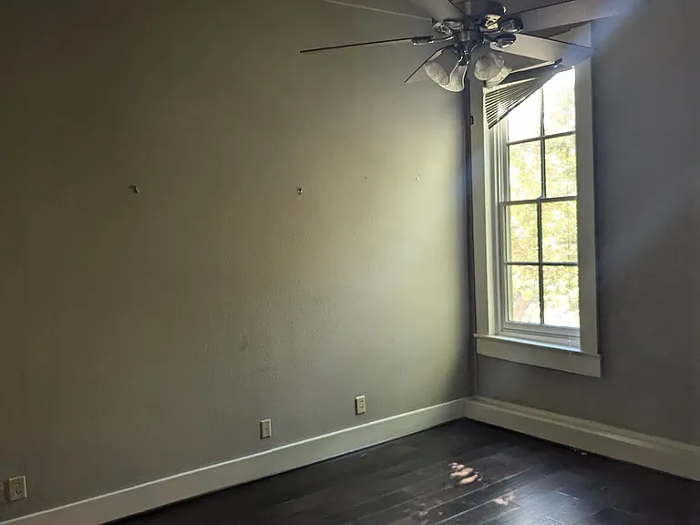 Main bedroom with 2 closets. Large enough for king bed and other furniture including an office desk. Overlooks garden and trees.