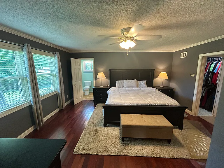 The Master Suite. The door ahead on the left leads to the Master Bathroom. The doorway on the right is opens up to the laundry room and additional closet space.