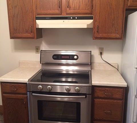 Kitchen with electric stove.