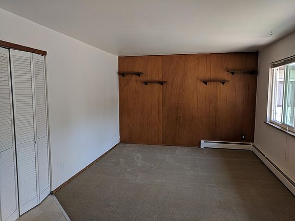 living room open to kitchen.  new  carpet and large windows