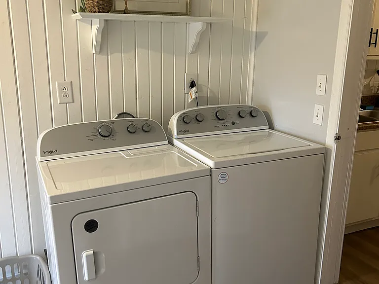 LAUNDRY ROOM INCLUDES SIDE BY SIDE WASHER AND DRYER