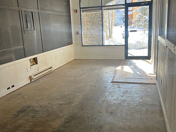 Entry and common room, could be waiting area with desk for nail, hair or other personal services, design space, drafting area, plumbing or electrician office and storage space, surveyor space or trade storage.