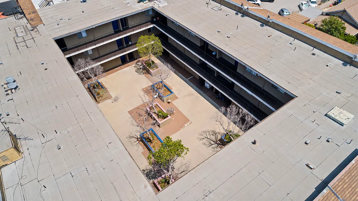 Aerial view highlighting the open courtyard and surrounding community layout. - Rose Pointe - Rosemont