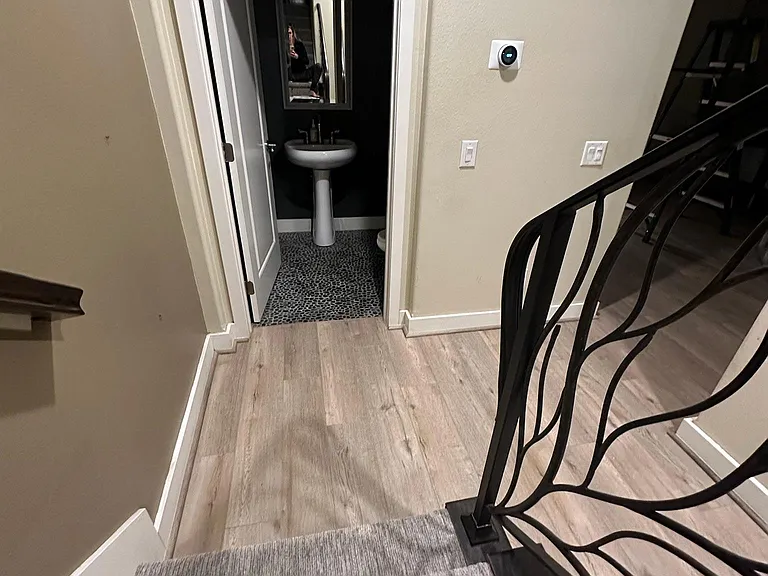 view from stairs to second floor looking at half bath
