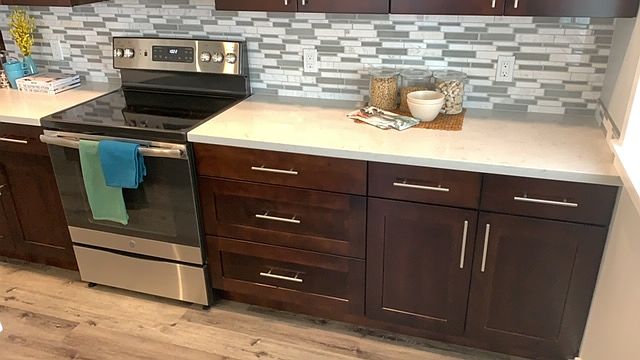 Kitchen showing the range and large drawer bank.