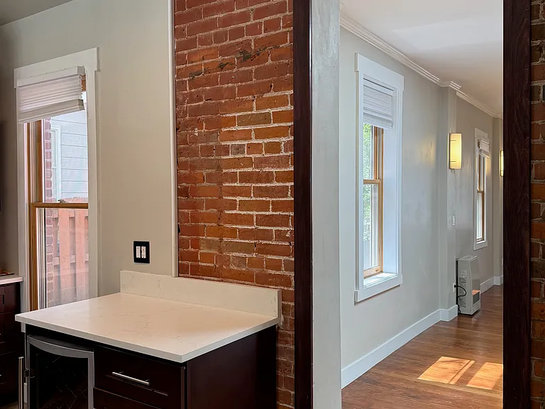 Entrance to kitchen. Brick is the outer wall from the original home