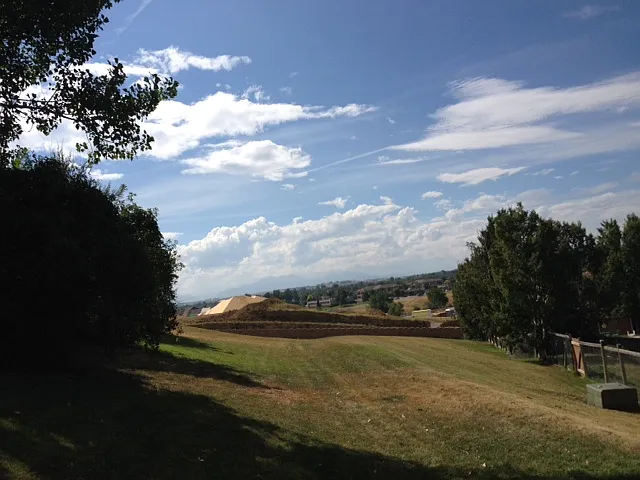 View from Greenbelt in front of the home (looking left to the Rocky Mountains and the Boulder area). To the right is more greenbelt, to the front is a sledding hill, home is behind at the top of this greenbelt.