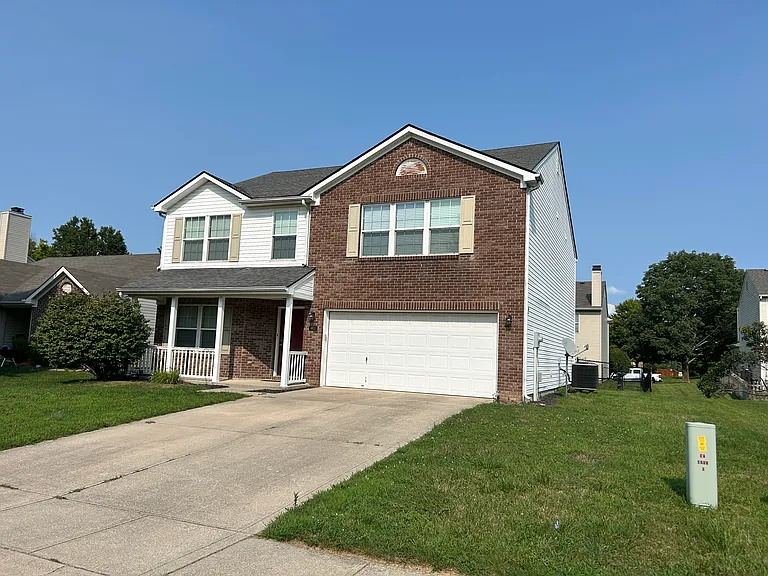 Front exterior - double garage with front patio