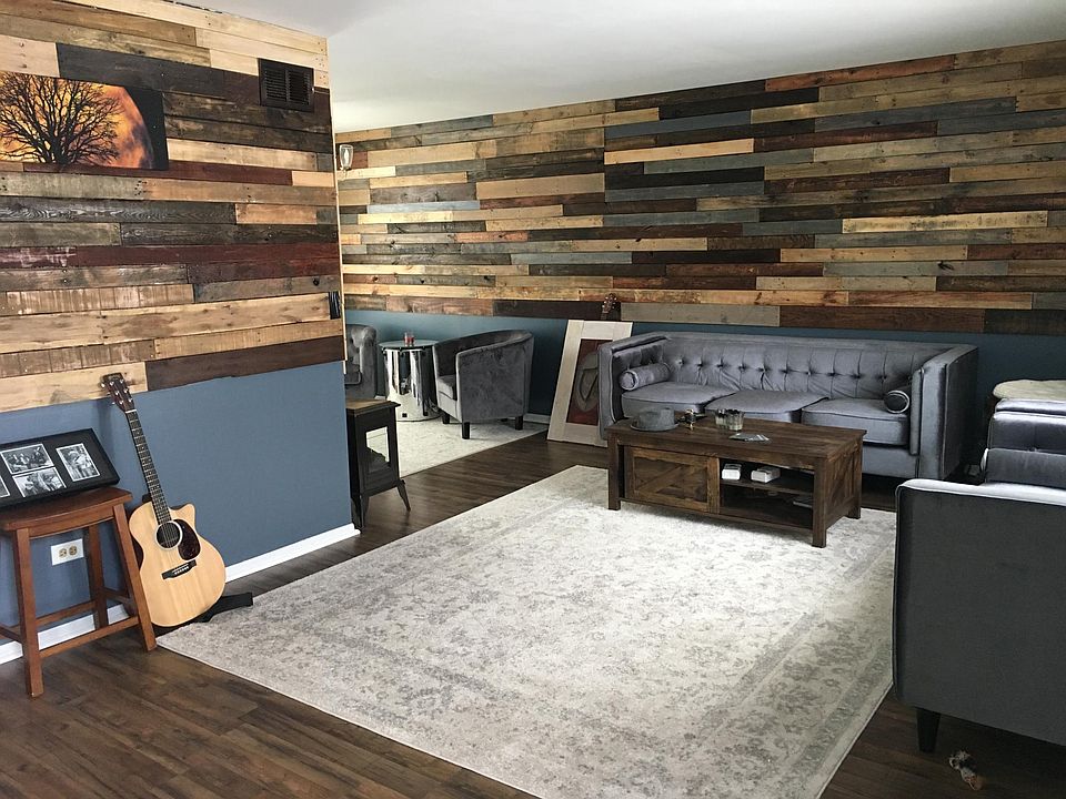 fully refreshed living room w pallet walls