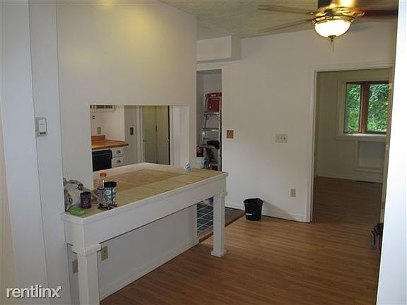 DINING ROOM DIVIDED BY BAR TO KITCHEN