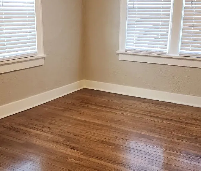 Large Bedroom with lots of natural light from windows.