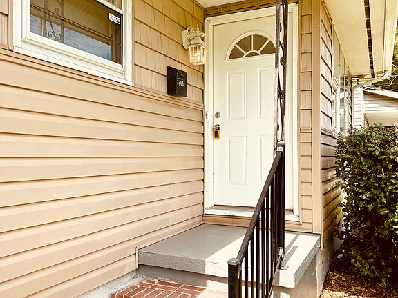 New fixtures and door offer an inviting entry.