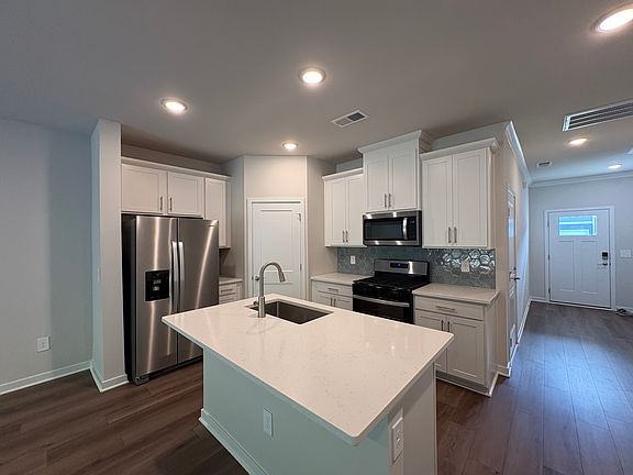 Gourmet kitchen with Whirlpool appliances (all included), gas stove, and spacious pantry