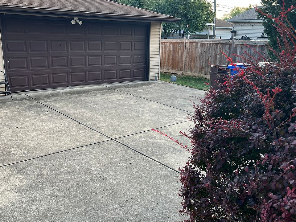 back cement patio and garage with side door