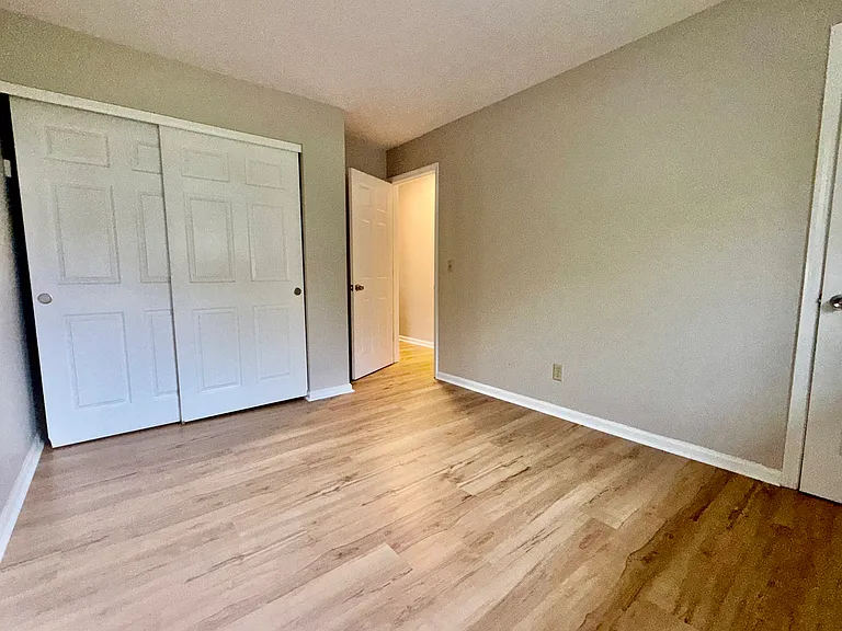 Bedroom with adjoining 1/2 bath.