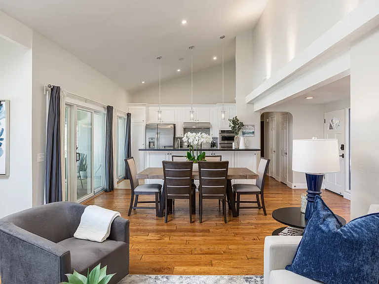 Keep the family connected from the kitchen, dining, and living room in the open floor plan with cathedral ceilings.