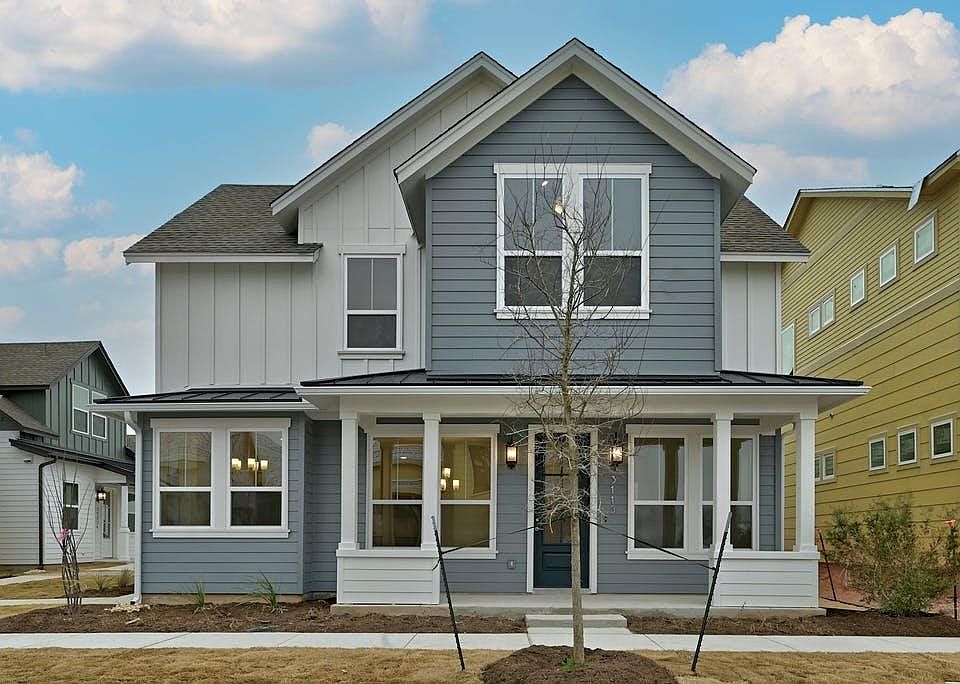 Street face. Nice sitting porch. 1st floor left window is kitchen, middle window dining, right window living. Second floor large right window is master bedroom, left window upstairs office.