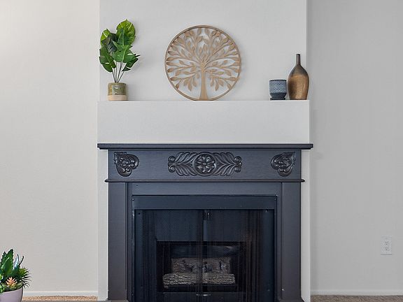A fireplace in an apartment living room at the Diplomat