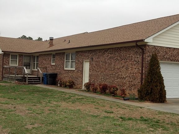 Back side of brick one story. Two car garage.  See front on sat pic til listed
