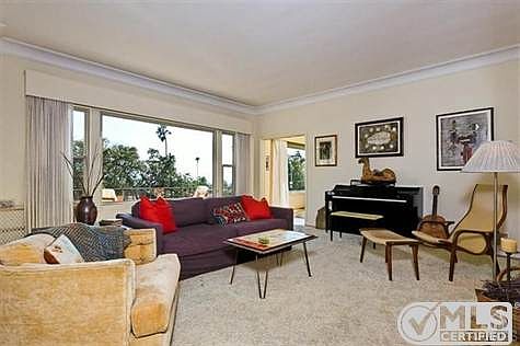 Spacious living room with high ceilings, wood floors and ocean views!