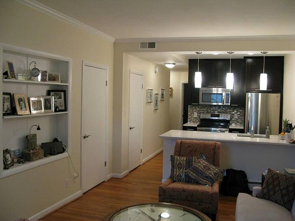 Stylish recessed display area in living room is perfect for photos, a TV, a music system, or books. Plenty of closet space and a pantry, too.