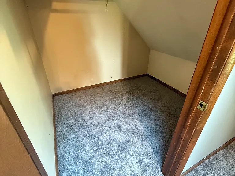 One of two master bedroom walk-in closets.