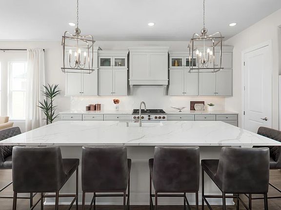 Kitchen with quartz island and countertops