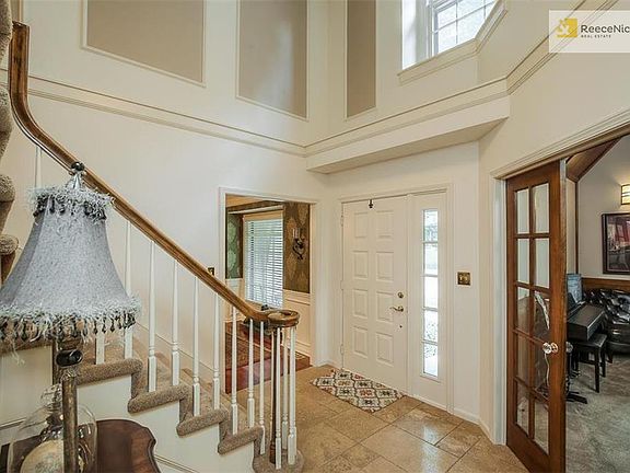 Two story entry leads to formal dining room, large office suite and Great Room on first floor.