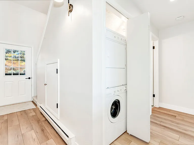 hallway to Bedroom #1 and full bath, on the main level. Laundry closet here