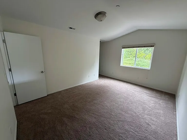Primary Bedroom
Large primary suite with vaulted ceilings and plenty of space to relax.