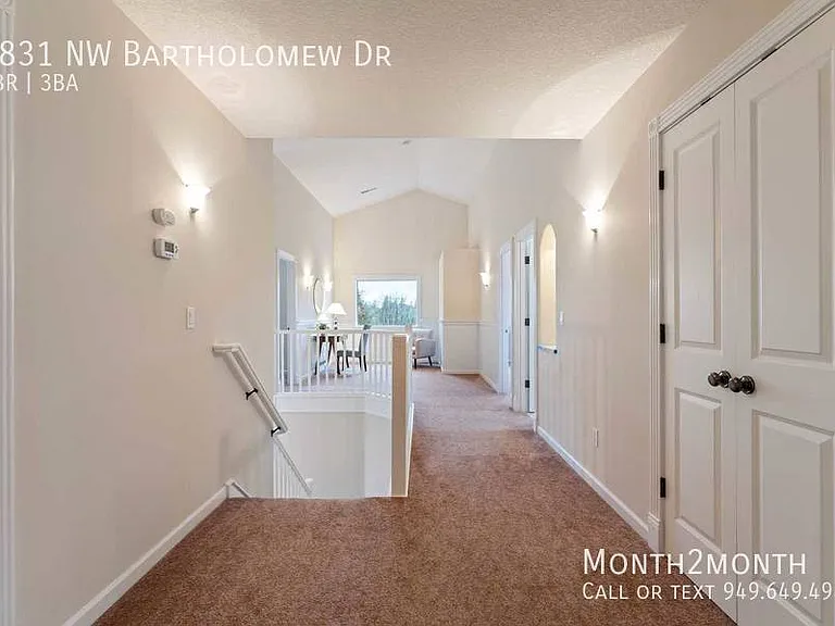 9831 NW Bartholomew Dr — Photo 27