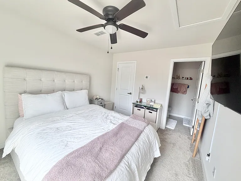 3rd bedroom with attached full bathroom, closet and larger slider door to private rooftop terrace