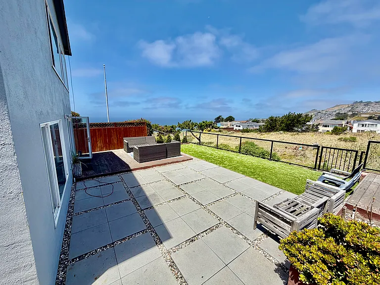 Huge backyard with chairs for ocean views