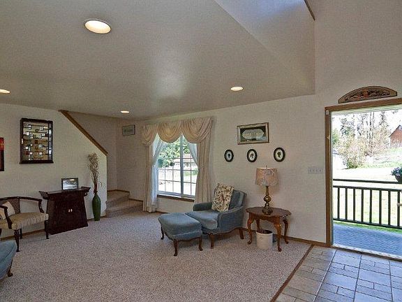 Tiled entry opens to bright formal living space.