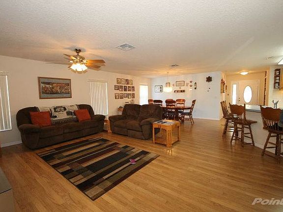 Enter into the Great Room with Wood Laminate Flooring